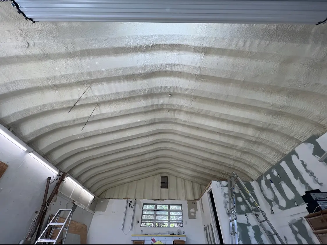 Spray polyurethane foam applied to the underside of a metal roof deck in Scottsboro